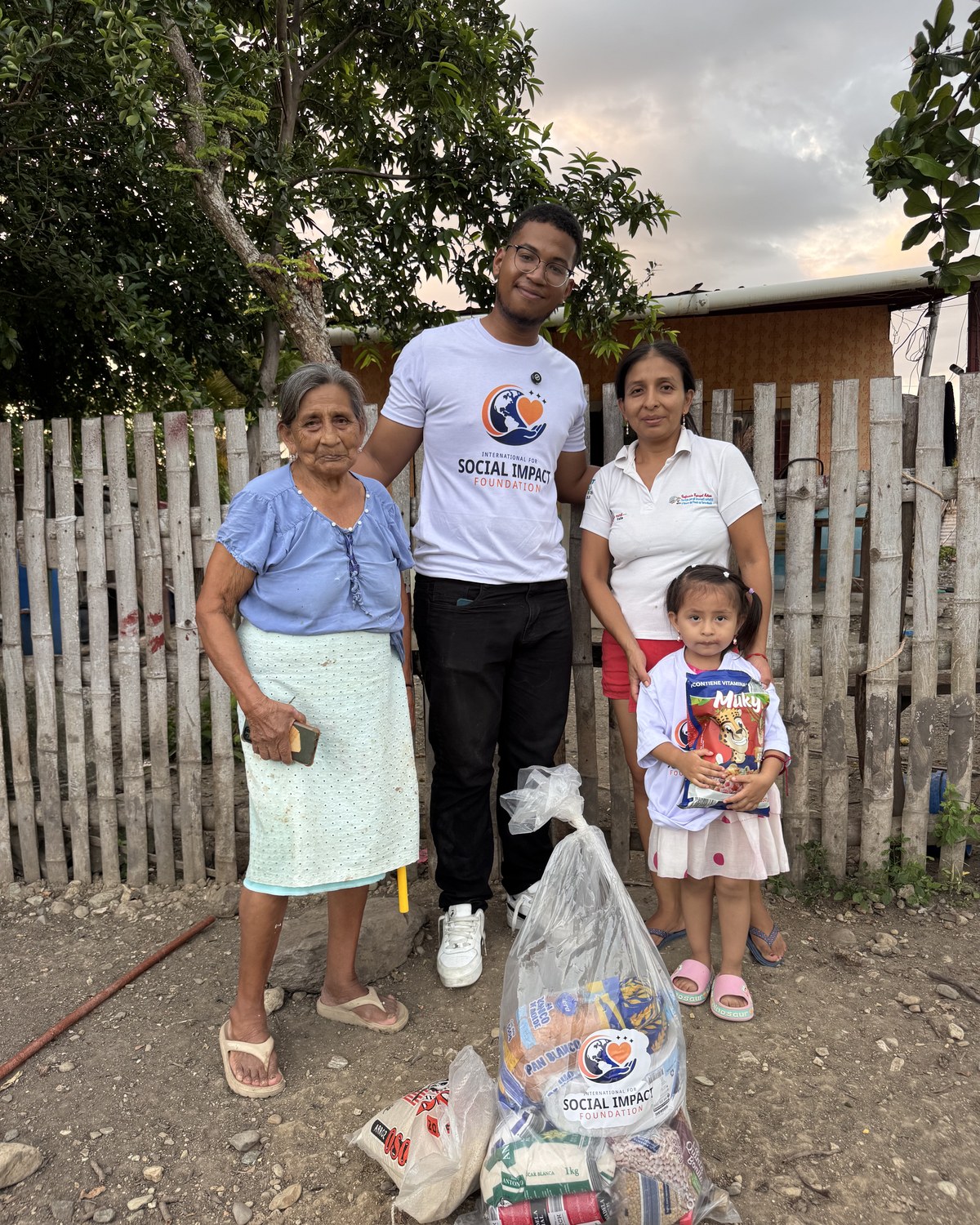 Family and community members receiving essential supplies from International for Social Impact Foundation